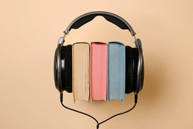 books with headphones around them